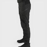 Alexandra Oradea Albert black tactical utility pants with multiple zippered pockets and adjustable ankle straps.